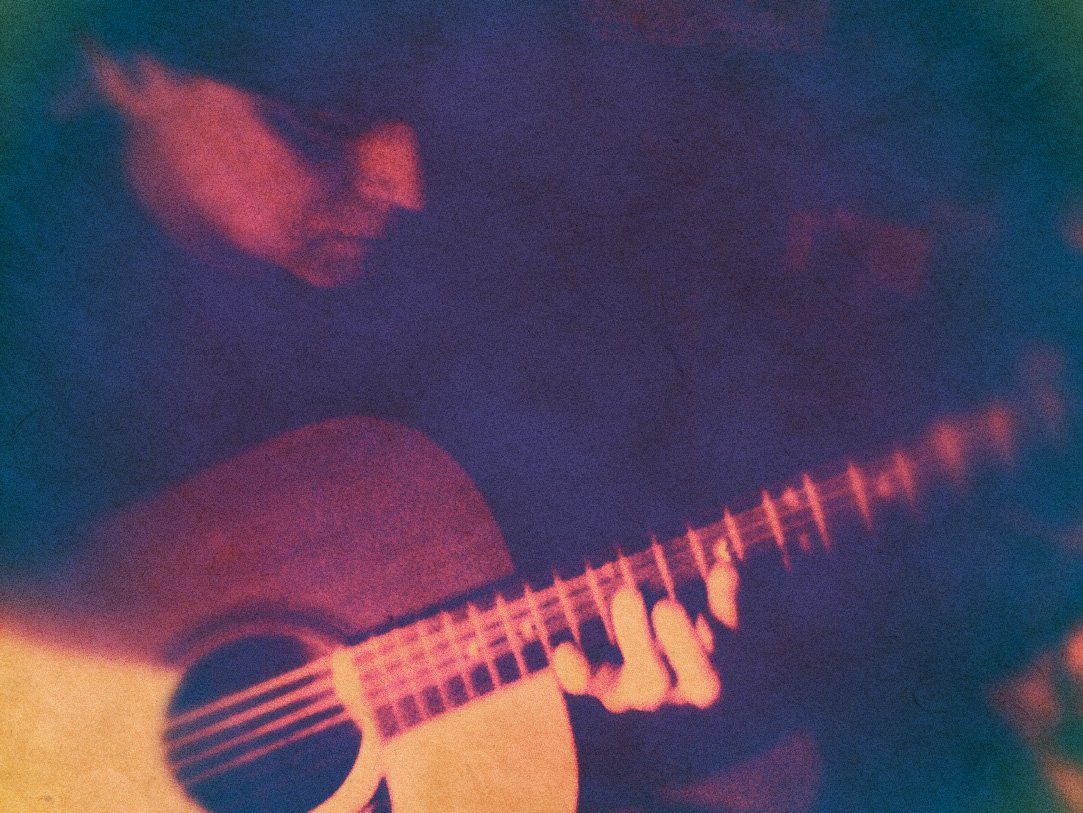 F. X. Stagliano playing guitar